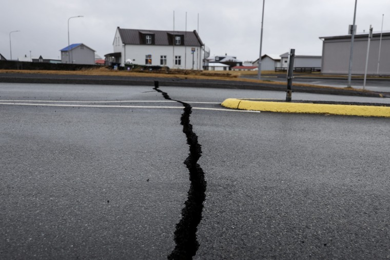 Cracks appear on a road due to volcanic activity near the police station in Grindavik, Iceland on November 11, 2023.