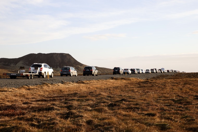 A line of cars queued on a road heading to Grindavik, Iceland on Nov. 13, 2023. Residents of Grindavik, a town in southwestern Iceland, have been briefly allowed to return to their homes on Monday after being told to evacuate on Saturday after increasing concern about a potential volcanic eruption caused civil defense authorities to declare a state of emergency in the region.