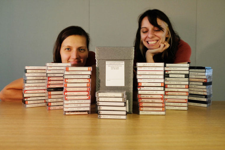 Filmmaker Meghan McDonough and cinematographer and photographer Rengim Mutevellioglu at Smith College Special Collections in Northampton, Mass., with tapes from the Old Lesbian Oral Herstory Project.