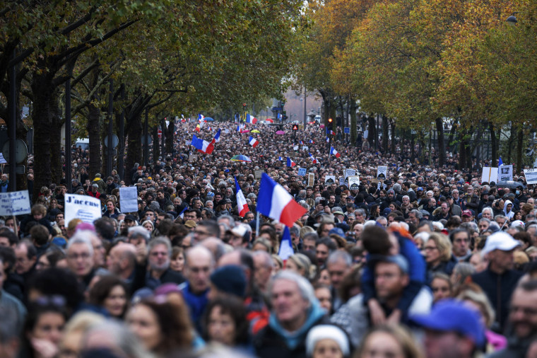 Tens of thousands of people march in Paris against anti-Semitism on Nov. 12, 2023. 