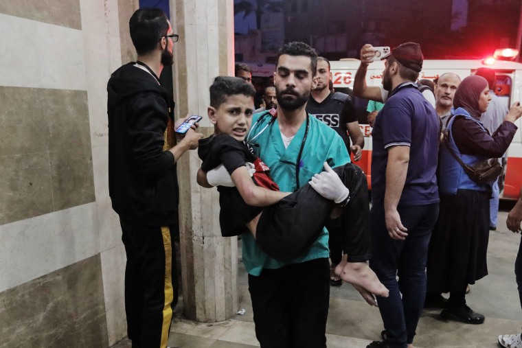 Injured Palestinians arrive at Nasser Hospital on Nov. 14, 2023 in Khan Younis, southern Gaza. 