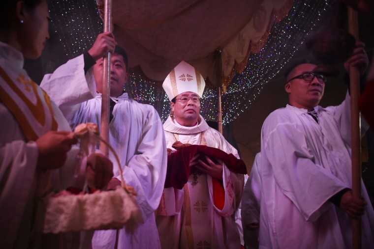 The head of the Catholic church in China began a trip to Hong Kong on Tuesday at the invitation of the city’s pope-appointed Roman Catholic cardinal, marking the first official visit by a Beijing bishop in history.
