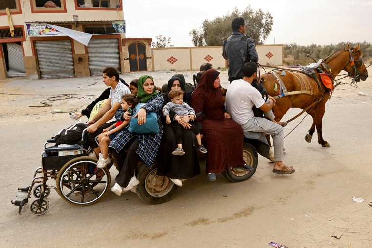 Palestinians fleeing north Gaza ride a horse-drawn cart as they move southward on Nov. 12.