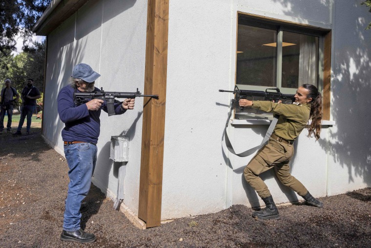 A civilian member of the first-response tactical team is armed with an automatic weapon during a simulated attack conducted by the Israel Defence Forces on the outskirts of Safed on Nov. 15, 2023.