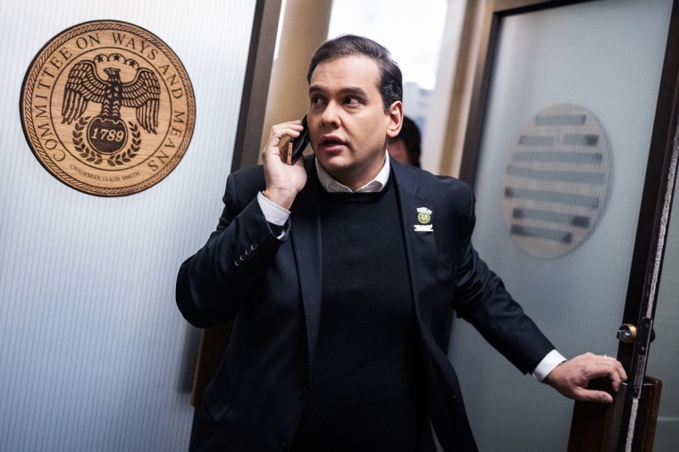 Rep. George Santos leaves a meeting in Longworth Building