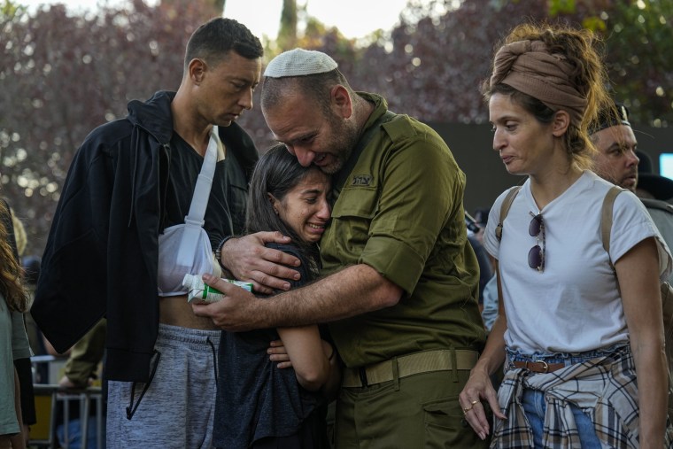 Mourners gather around the grave of Israeli reserve soldier captain Omri Yosef David during his funeral in Carmiel, northern Israel, on Nov. 15, 2023. David, 27, was killed during a military ground operation in the Gaza Strip. 