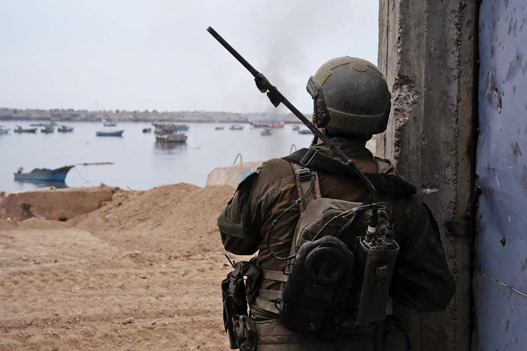 An Israeli soldier looks out at Gaza harbor on Nov. 16, 2023.