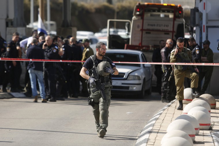 Israeli police secure the scene after an attack by gunmen at a checkpoint between the West Bank and Jerusalem on Nov. 16, 2023. 