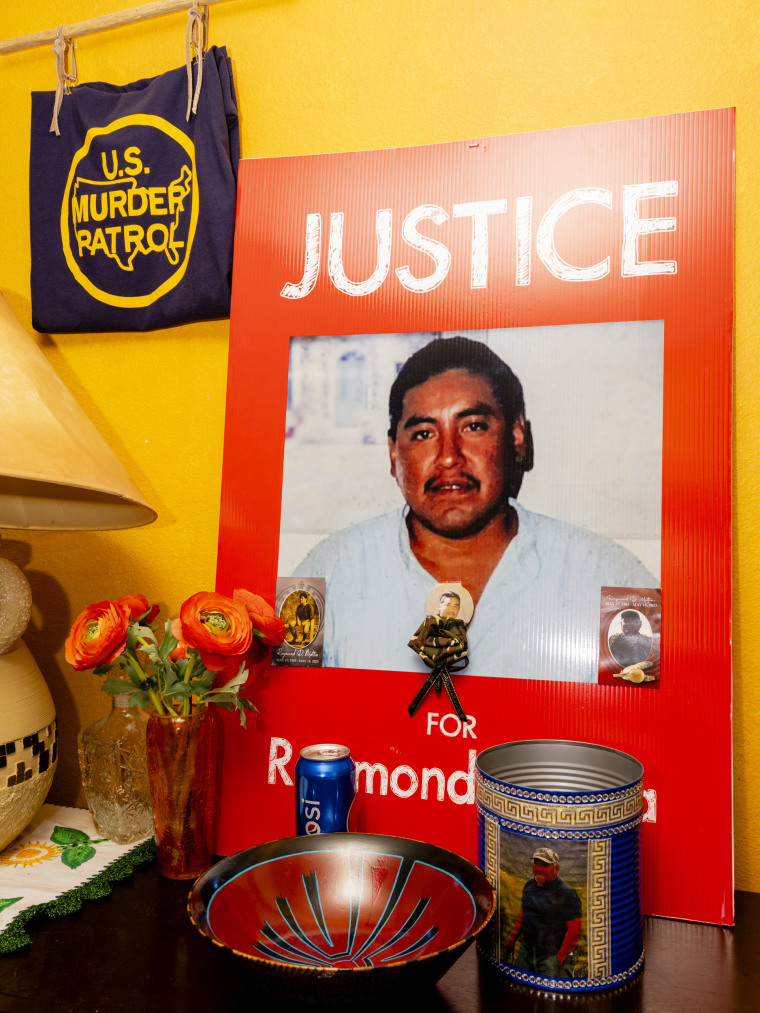 A placard stating “Justice for Raymond Mattia” propped up in the living room of his sister Annette Mattia’s house