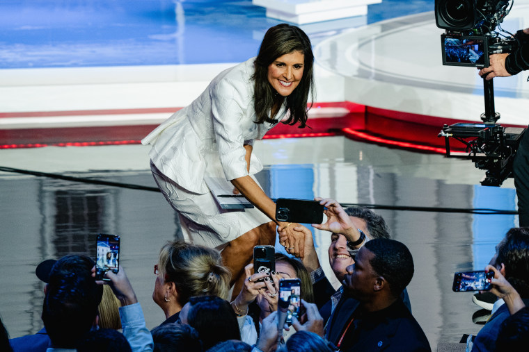 Former U.N. Ambassador Nikki Haley shakes hands and takes photos with attendees after the  Republican presidential debate in Miami.Image: