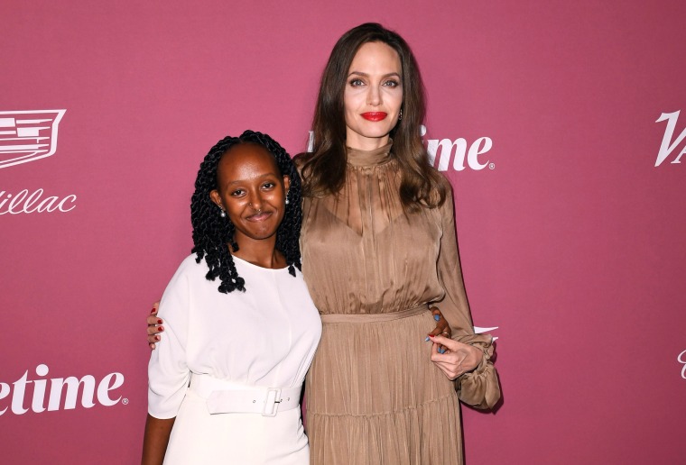Zahara Jolie-Pitt and Angelina Jolie pose at the step-and-repeat of the Variety's Power Of Women