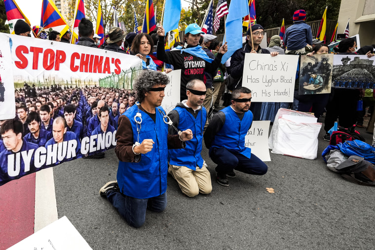 Image: Demonstrators gather outside of the Chinese Consulate