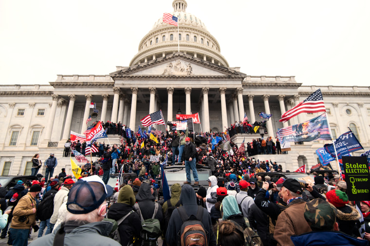 Trump supporters riot on the steps of the Capitol.