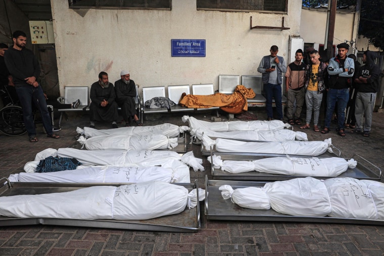 Palestinians mourn overs bodies following overnight Israeli bombardment in Rafah in the southern Gaza Strip on Nov. 17, 2023.