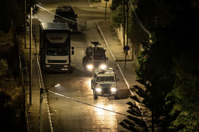 Israeli military vehicles during a raid in the Jenin refugee camp in the occupied West Bank on Nov. 16, 2023. 