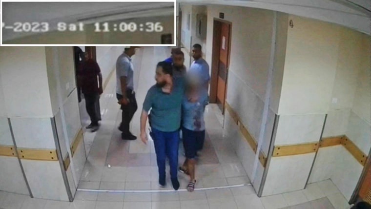 Security camera footage released by the Israeli army on Nov. 19, 2023, shows what the army reports as Hamas fighters leading hostages into Al-Shifa hospital on Nov. 7.