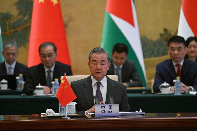 China's Foreign Minister Wang Yi attends a meeting with foreign ministers from Arab and Muslim-majority nations in Beijing on Nov. 20, 2023.
