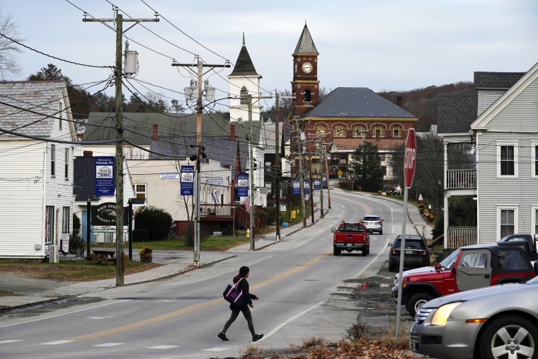 A woman crosses Main Street in Hinsdale, N.H. 