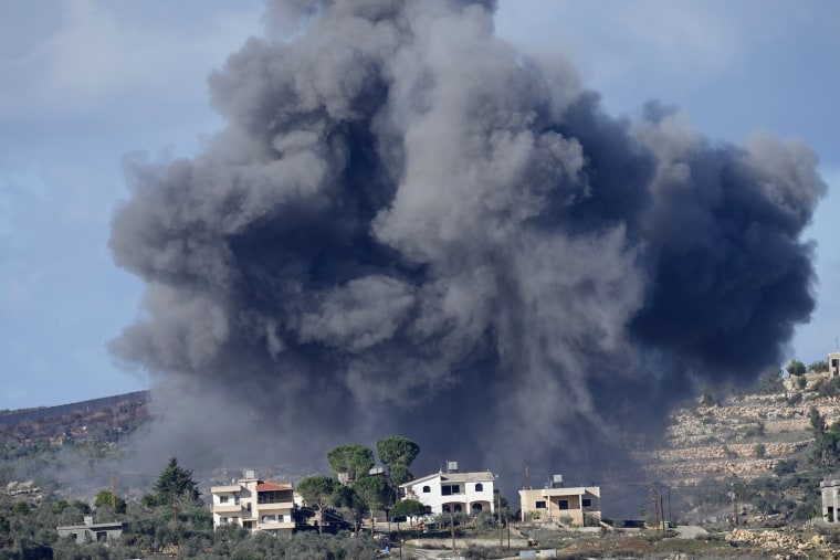 Black smoke rises from an Israeli airstrike on the outskirts of Aita al-Shaab, a Lebanese border village with Israel, on Nov. 21, 2023. 