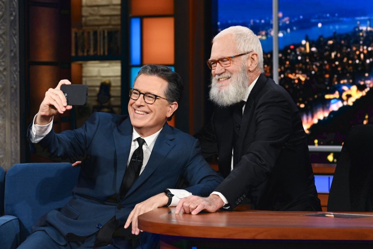 Stephen Colbert and guest David Letterman take a selfie.
