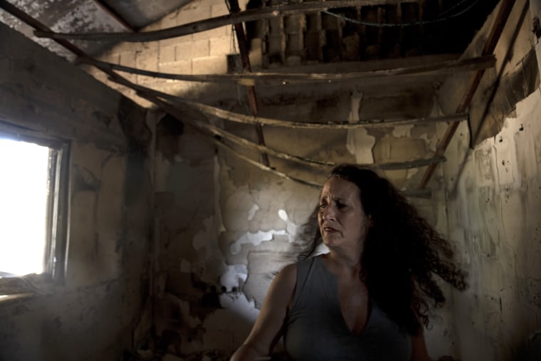 Hadas Kalderon stands in the ruins of her mother's home in Kibbutz Nir Oz, southern Israel, on Oct. 30, 2023. 