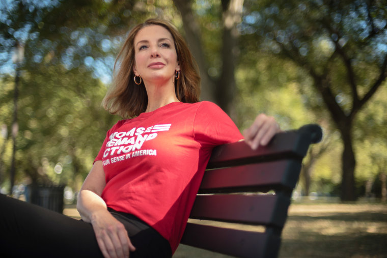Shannon Watts sits on a park bench