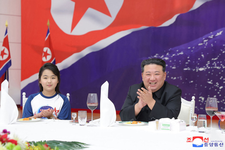 Kim and daughter celebrate satellite launch in Pyongyang