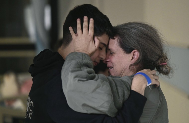 Sharon Hertzman, right, hugging a relative as they reunite at Sheba Medical Center in Ramat Gan, Israel, on Nov. 25.