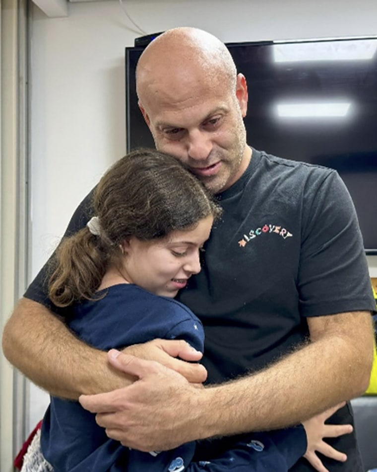 Image: Hila Rotem Shoshani, a released hostage, reunites with her uncle