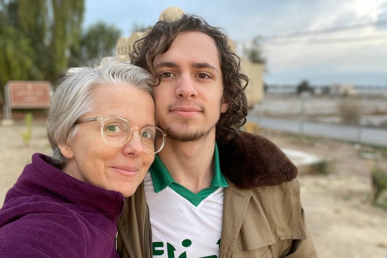 Hisham Awartani and his mother Elizabeth Price pose for a photo.