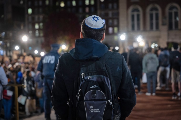 A Jewish student watches a protest in support of Palestine and for free speech at Columbia University on Nov. 14, 2023 in New York.