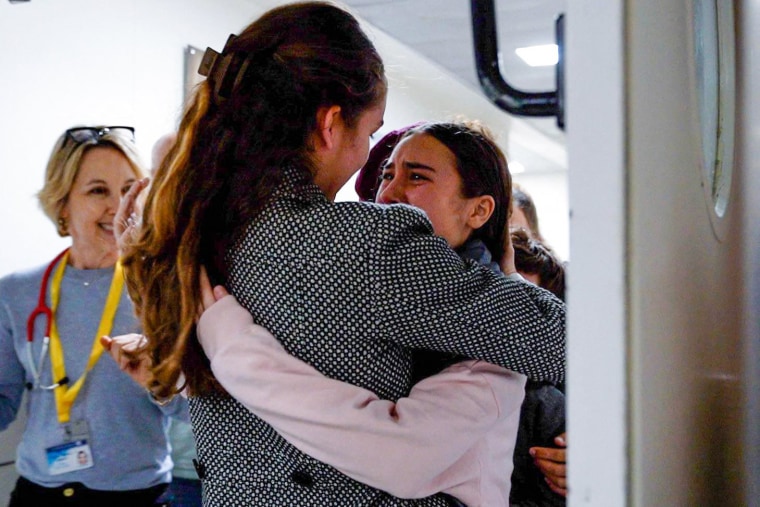 Released Israeli hostage Sahar Kalderon, 16, is embraced by a relative upon her arrival at Sourasky Medical Center in Tel Aviv on Nov. 27, 2023.