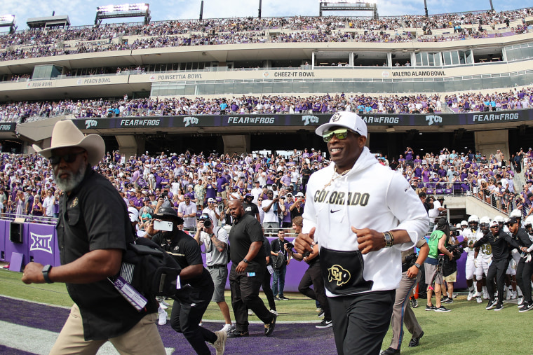 Head coach Deion Sanders on the field before a game in Fort Worth, Texas.