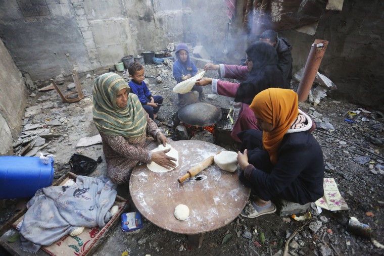 Palestinians make bread on the streets of Gaza