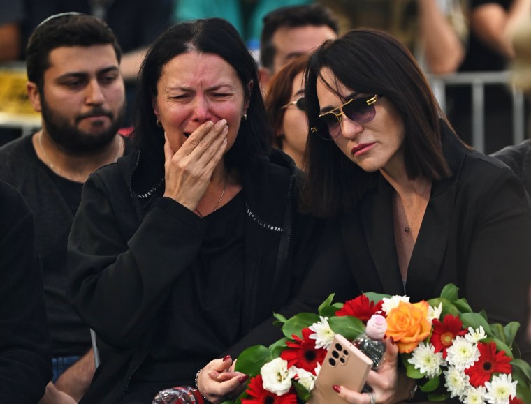 Lena Brodski, left, mourns her son, Sergeant Kiril Brodski, a 19-year-old Israeli soldier who was killed on Oct. 7, during his funeral at the Kiryat Shaul Cemetery on Nov. 29, 2023 in Tel Aviv, Israel. Yesterday, the Israel Defense Forces announced the death of Sgt. Brodski and two other soldiers who were initially believed to have been kidnapped during Hamas's Oct. 7 attack. However, after examining new evidence, the IDF determined that they were killed during the initial attack and their remains were taken to Gaza. 