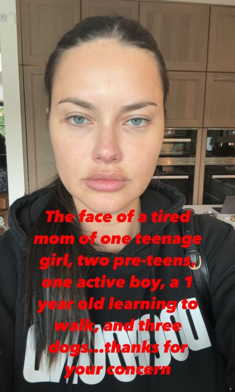 Lima in her kitchen with her hair in a ponytail and a makeup free face. "The face of a tired mom of one teenage girl, two pre-teens, one active boy, a 1 year old learning to walk, and three dogs...thanks for your concern," the red text on the photo reads.