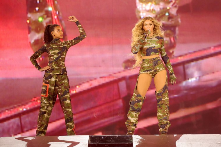 Blue Ivy Carter and Beyoncé perform onstage at a "Renaissance" world tour show in Atlanta in August.