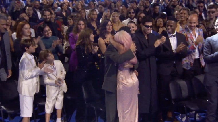 Feid and Karol G embraced after she won best urban album of the year at the 2023 Latin Grammys.