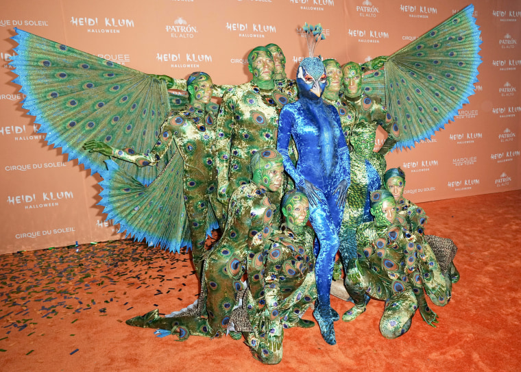 Heidi Klum Transforms Into a MultiPerson Peacock for Halloween 2023