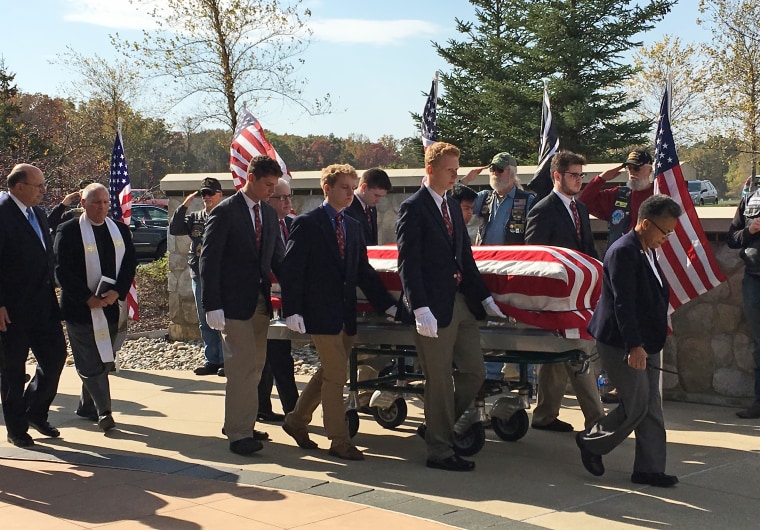 Students at the all-boys University of Detroit Jesuit School serve as pallbearers for a veteran in 2015.