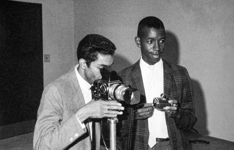 Photographer, Cecil J. Williams photographing an event with a Hasselblad camera at Claflin University in Orangeburg, South Carolina on Jan. 1, 1960.