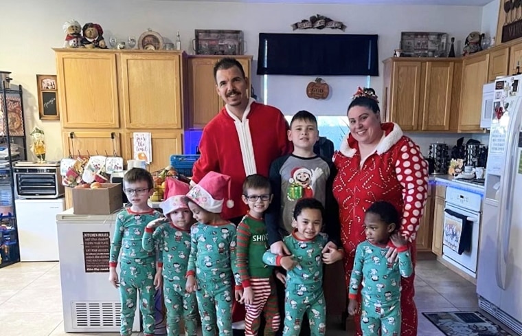 Karen Lopez and her husband Jerry Lopez, with their seven children in Dec. 2023. Jerry Lopez, 39, was killed in Las Vegas two days after Christmas while on his way to work in what Las Vegas police say was the final carjacking in a crime spree.