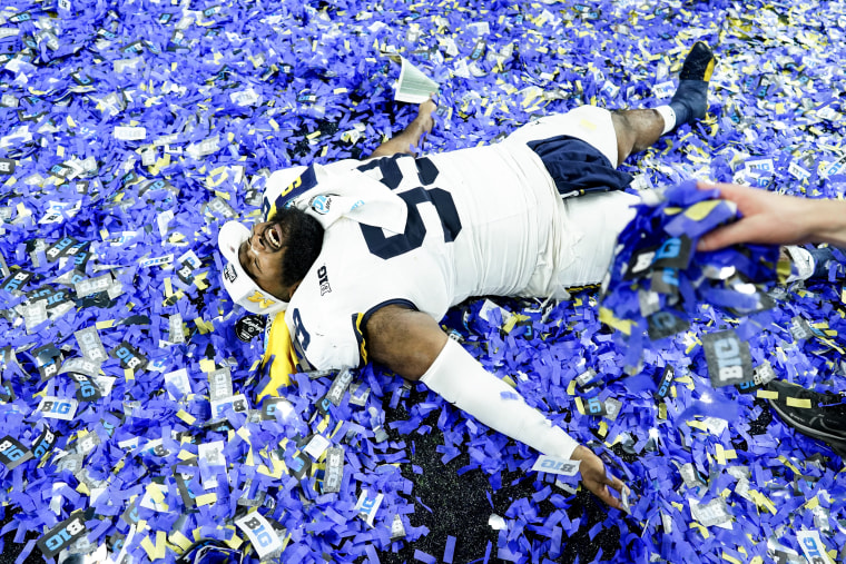 Michigan defensive lineman Cam Goode celebrates after the Big Ten championship NCAA college football game against Iowa, in Indiana, Indianapolis on Dec. 2, 2023.