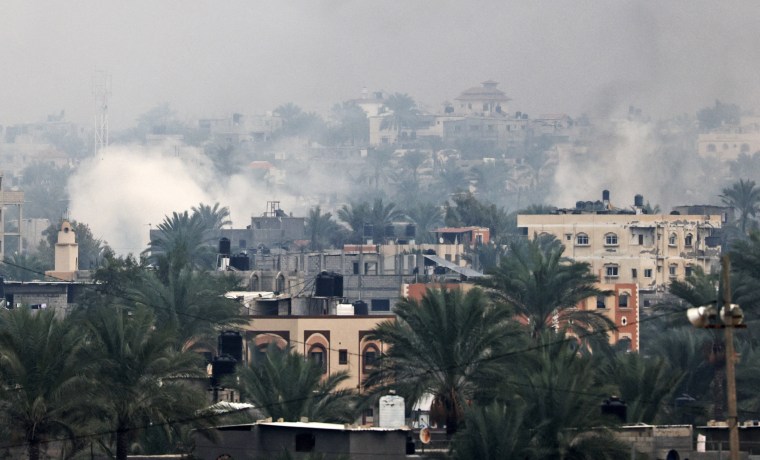 Smoke rises above buildings in Khan Younis in the southern Gaza Strip on Dec. 5, 2023.