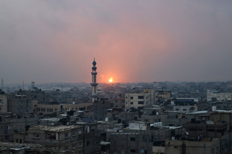 An explosion in Khan Yunis is visible from Rafah in the Gaza Strip on Dec. 5, 2023.