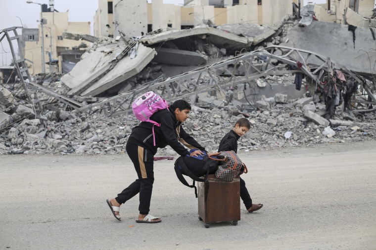 Palestinians fleeing the Israeli ground offensive arrive in Rafah, Gaza Strip, Tuesday, Dec. 5, 2023. 