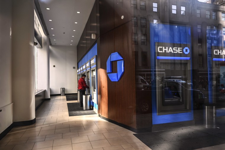 A person uses a Chase Bank atm.