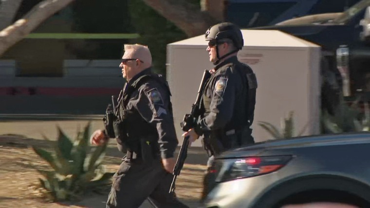 Police respond at the scene of a shooting at the University of Las Vegas.