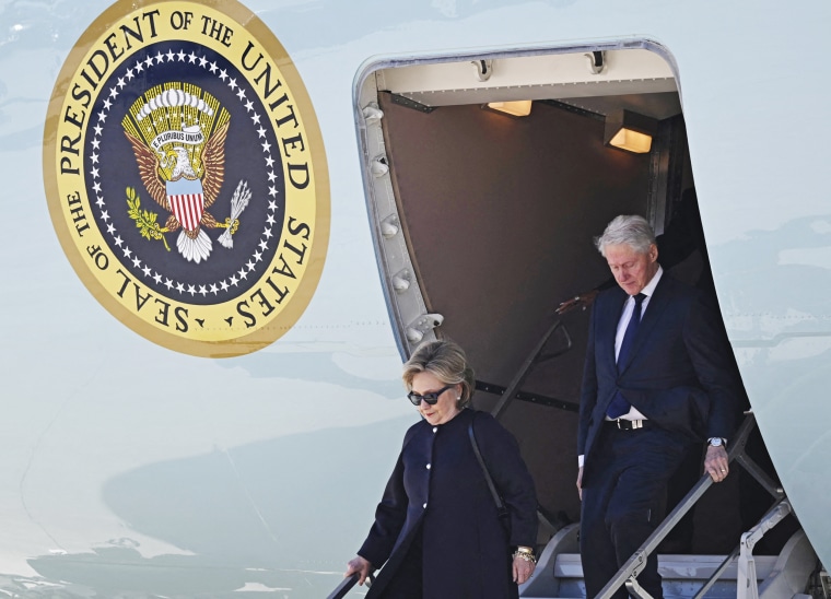 Former President Bill Clinton and former Secretary of State Hillary Clinton disembark Air Force One at Dobbins Air Reserve Base in Marietta, Ga., on Nov. 28, 2023, to attend services for former first lady Rosalynn Carter.