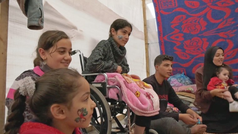Razan, center, at a camp for the displaced in Rafah.